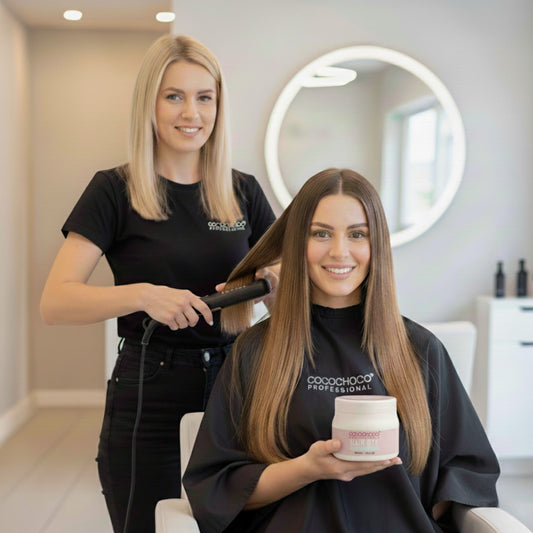 Woman getting her hair styled by a hairdresser in a salon setting. with cocochoco treatment